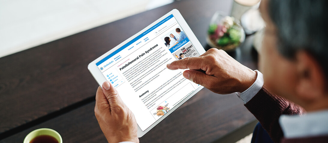 man looking at tablet